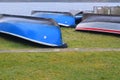 Inverted boats dry on the shore. Royalty Free Stock Photo