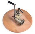 Inverted old hand meat grinder on the wooden serving board Royalty Free Stock Photo