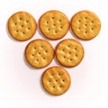 Inverted pyramid of round crackers on white