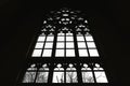 Inverted silhouette of large medieval window in backlight in Gothic style