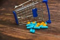 Inverted trolley and pills and medicines lie nearby, the concept of the uselessness and futility of treatment