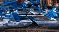 Inverted walking boats for wintering in the park. winter boat storage. Stacked up rowboats of a boat hire in winter Royalty Free Stock Photo