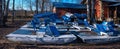 Inverted walking boats for wintering in the park. winter boat storage. Stacked up rowboats of a boat hire in winter Royalty Free Stock Photo