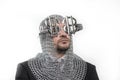 invest, businessman with medieval executioner in metal and silver glasses. concept of protection of savings and money