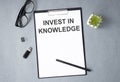 Invest in Knowledge text, inscription, phrase