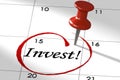 Invest word marked on calendar with push pin