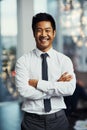 Invest in your future daily. Portrait of a well-dressed businessman standing in a office. Royalty Free Stock Photo