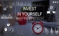 Invest In Yourself Phrase Over Background With Clock On Desk