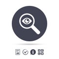 Investigate icon. Magnifying glass with eye. Royalty Free Stock Photo