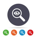 Investigate icon. Magnifying glass with eye. Royalty Free Stock Photo