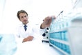 Chemist looking at test-tubes with blue liquids Royalty Free Stock Photo