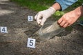 Investigator collects evidence - crime scene investigation