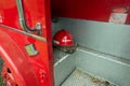 An Investigator Helmet in an Old Red Fire Truck Royalty Free Stock Photo