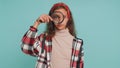 Investigator teenager child girl kid holding magnifying glass near face, big eye searching analysing Royalty Free Stock Photo