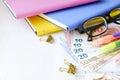 Investing time and money into education concept. Different school supplies, banknotes. Top view, close up. Royalty Free Stock Photo