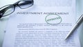 Investment agreement approved, seal stamped on official document, business Royalty Free Stock Photo