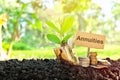 Investment on annuities concept. Coins in a jar with soil and growing plant Royalty Free Stock Photo