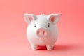 Investment concept - whitet pig shaped moneybox, pink solid color background