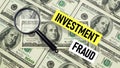 Investment fraud is shown using the text and photo of dollars Royalty Free Stock Photo