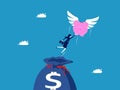 Investment freedom. Businesswoman flying with piggy bank coming out of money bag