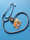 investment in health care, Swiss money and stethoscope for medical check