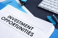 Investment opportunities report in the blue folder