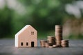 Investment in the real estate business. Money coin stack growing graph and wood house model. Loans for the purchase of residential Royalty Free Stock Photo