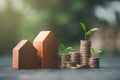 Investment in the real estate business. Money coin stack growing graph and wood house model. Loans for the purchase of residential Royalty Free Stock Photo