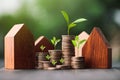 Investment in the real estate business. Money coin stack growing graph and wood house model. Loans for the purchase of residential Royalty Free Stock Photo