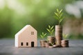 Investment in the real estate business. Money coin stack growing graph and wood house model. Loans for the purchase of residential Royalty Free Stock Photo