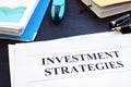 Investment strategies and folder with business documents. Royalty Free Stock Photo