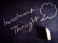 investment thoughts symbol presented on chalkboard concept