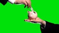 Investor puts money in partners piggybank green screen background, financial aid