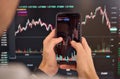 Investor trader analyzing crypto stock trade invest mobile market. Over shoulder Royalty Free Stock Photo