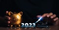 Investors decide investment , gold piggy bank and coin with digital graph