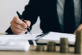 Investors are writing investment records and growth of mutual funds on the table at the office Royalty Free Stock Photo