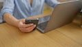 Invincible woman business executive working tirelessly, hands on laptop, texting on smartphone at the office Royalty Free Stock Photo