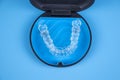 Invisalign transparent braces in a plastic case. Orthodontic invisible retainers and aligners