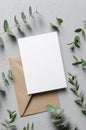 Invitation card mock up with envelope and nature plant decorations Royalty Free Stock Photo