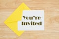 You`re invited message on wood table Royalty Free Stock Photo