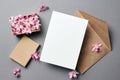 Invitation or greeting card mockup with envelope and hyacinth flowers on grey background Royalty Free Stock Photo