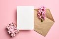 Invitation or greeting card mockup with envelope and spring hyacinth flowers on pink background Royalty Free Stock Photo