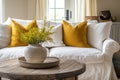 The inviting ambiance of the living room is enhanced by the cozy white sofa adorned with cheerful yellow, AI generated Royalty Free Stock Photo