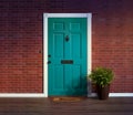 Inviting blue front door with welcome mat