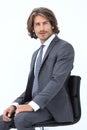 Inviting business man sitting on chair with relaxed attitude Royalty Free Stock Photo