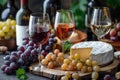 Elegant wine and cheese tasting setup with grapes and bottles Royalty Free Stock Photo