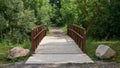 Inviting Footbridge leading to a woodland hiking path in Niagara Falls Region Royalty Free Stock Photo