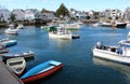 Inviting historic seaside town with quaint facade of shops and all types of colorful boats, Rockport Mass, 2018