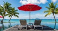 Infinity Pool with Red Umbrella and Lounge Chairs Overlooking Tropical Ocean swimming pool beach chairs Royalty Free Stock Photo