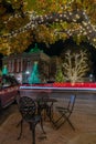 Inviting MEtal Table and Chairs Next to a Lit Up Oak Tree in the Georgetown Square Royalty Free Stock Photo
